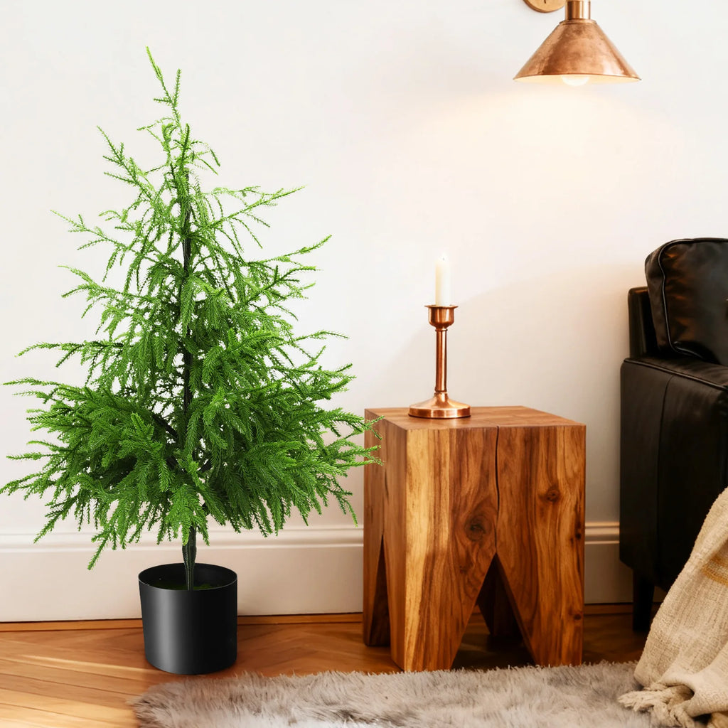 The 90 cm potted tree appears in an interior scene.