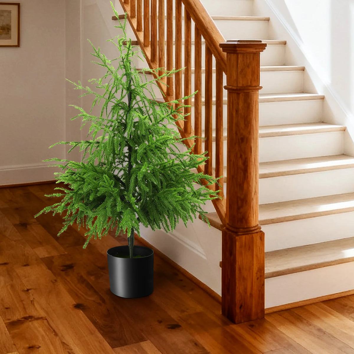 The 90 cm potted tree appears in a living room scene.
