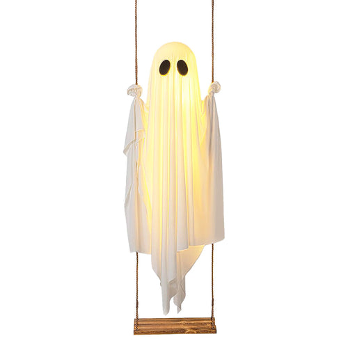 Lighted white swinging ghost decoration on a suspended seat