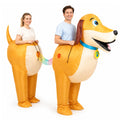 Two adults wear the front and rear sections of a golden dachshund costume joined by a rainbow connector.