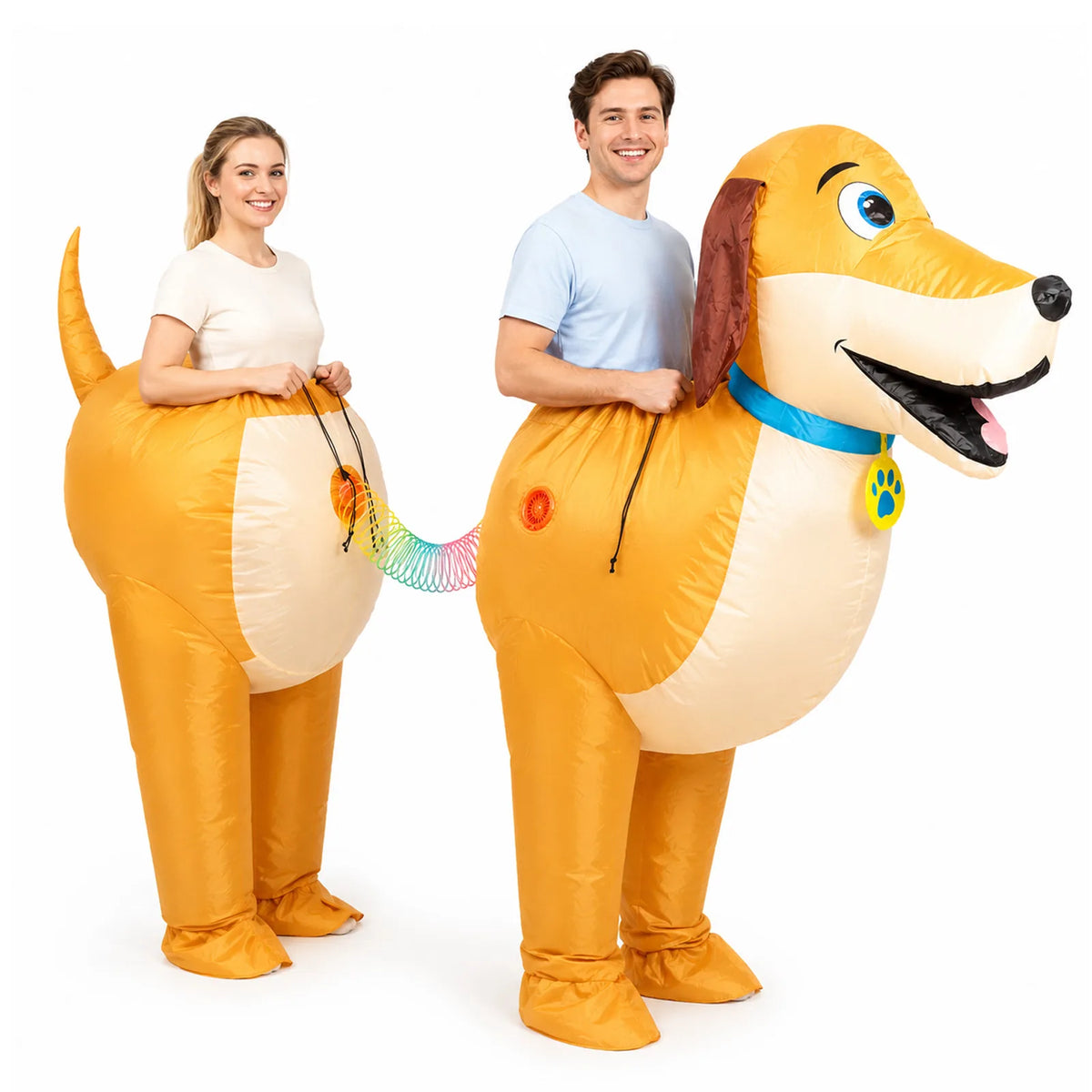 Two adults wear the front and rear sections of a golden dachshund costume joined by a rainbow connector.