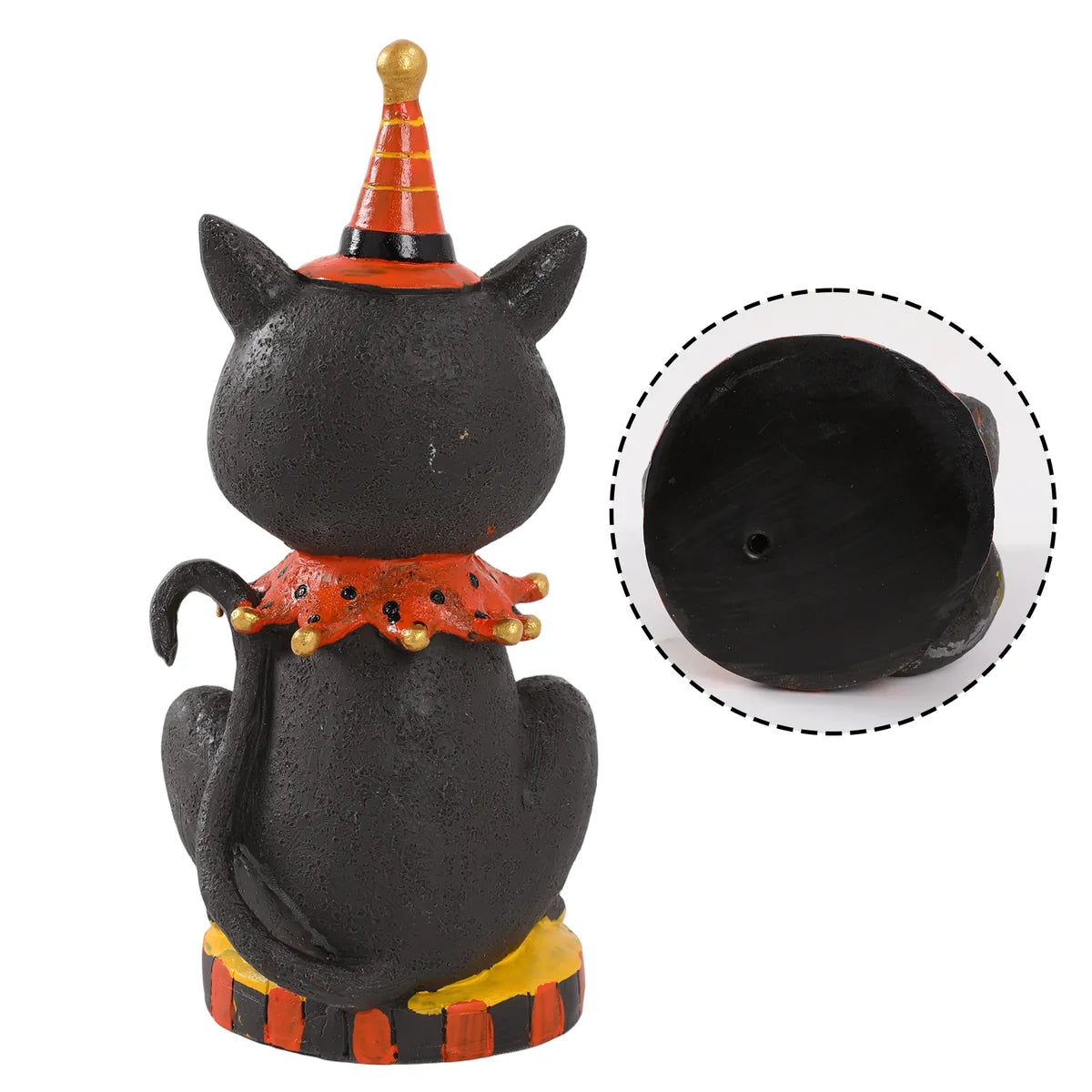 Back view of the vintage smiling black cat figurine shows the curved tail, orange collar, and hollow base.