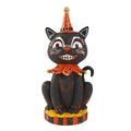 Vintage-style smiling black cat figurine with an orange party hat.
