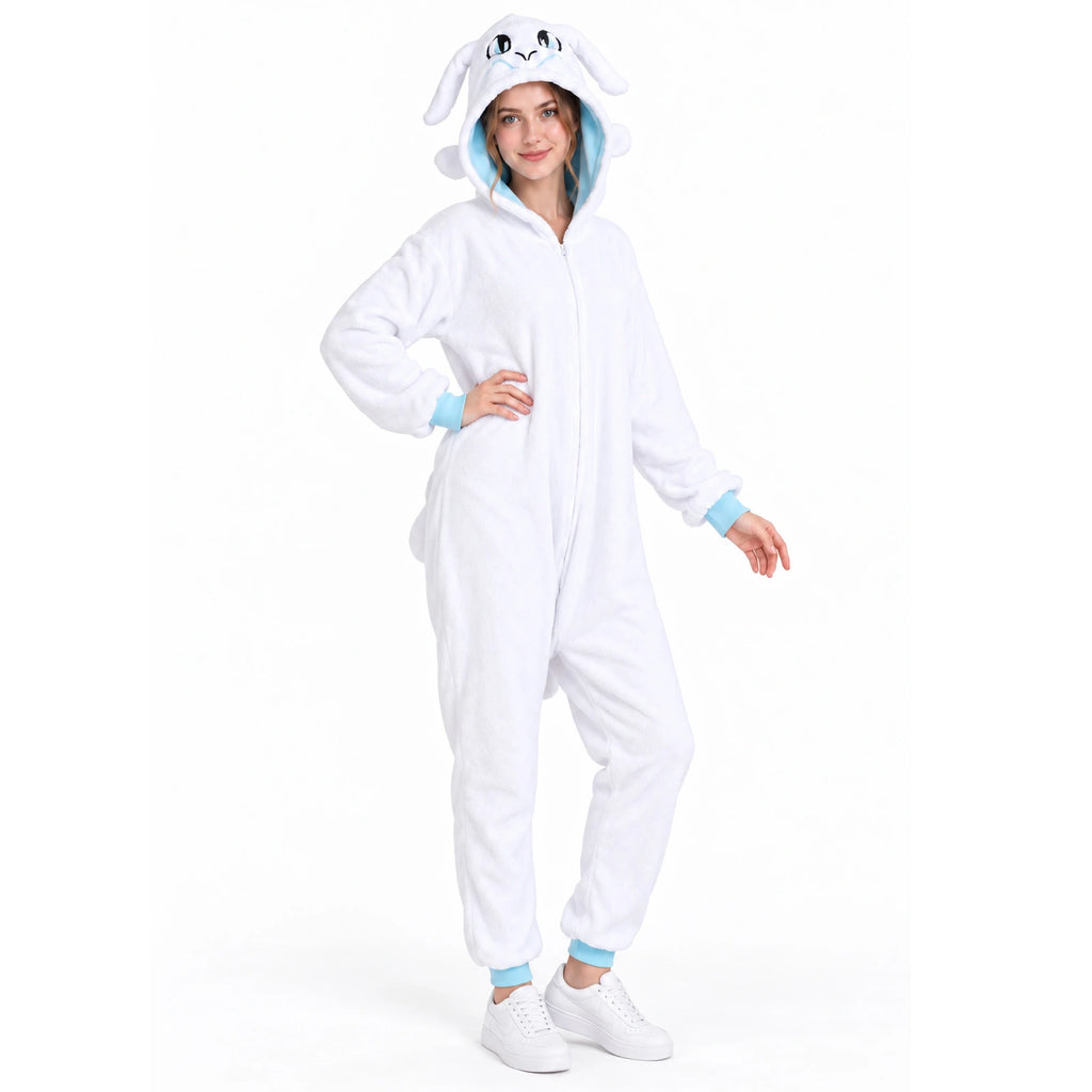 Full-length view of a model with one hand on her hip in the white dragon onesie with pale blue cuffs.