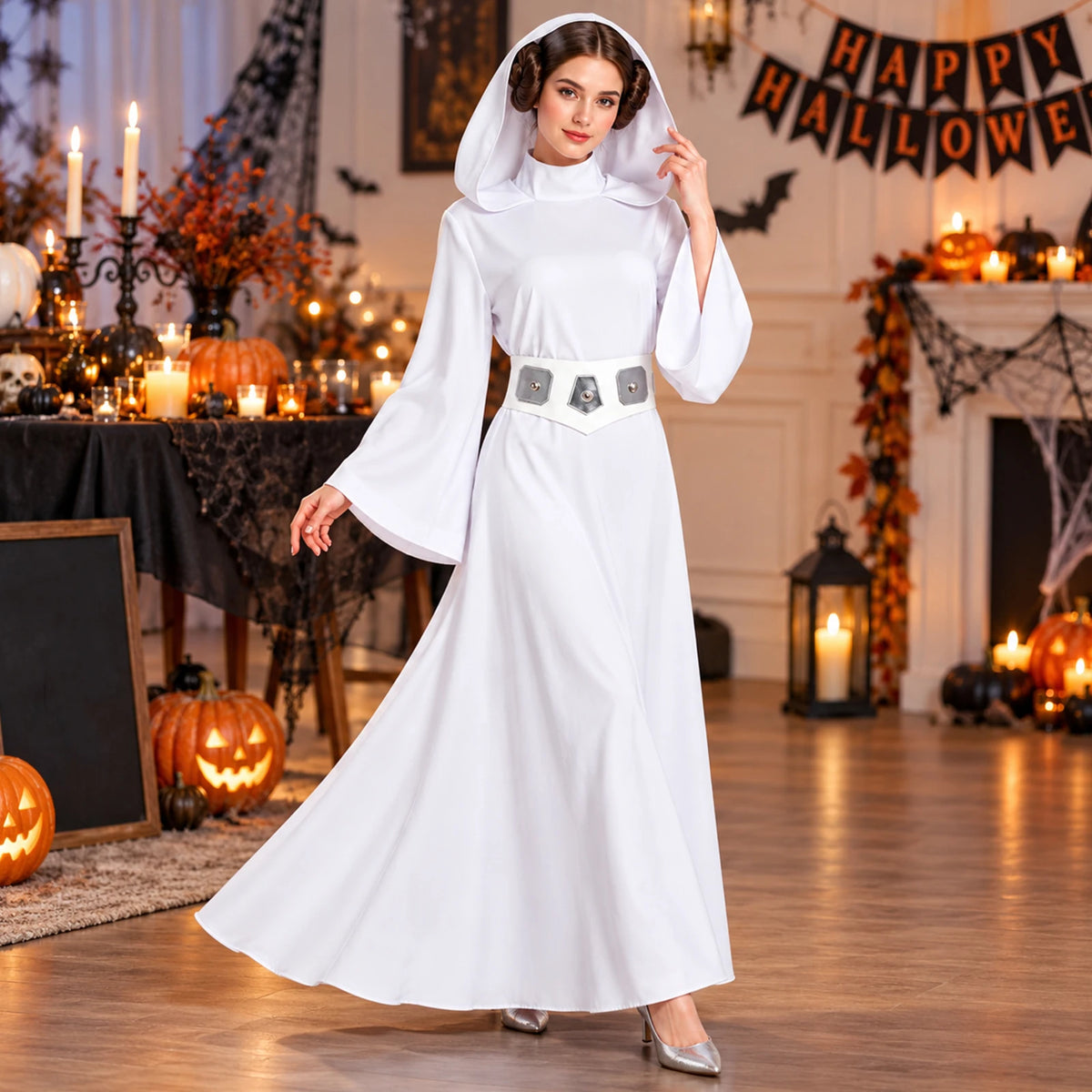 A woman wears the white hooded dress and Princess Leia-inspired side-bun wig beside pumpkins and Halloween party decorations.
