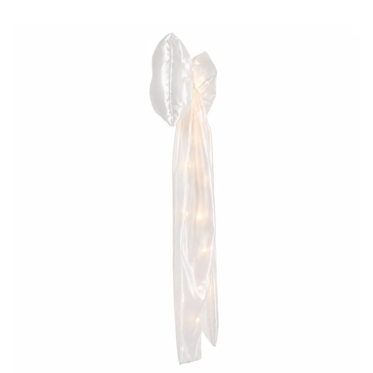Side view of the white led bow decoration, showing its profile and visible construction details.