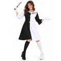 A woman models the Art the Clown-inspired black-and-white dress with mismatched socks, white gloves and the theatrical prop knife.