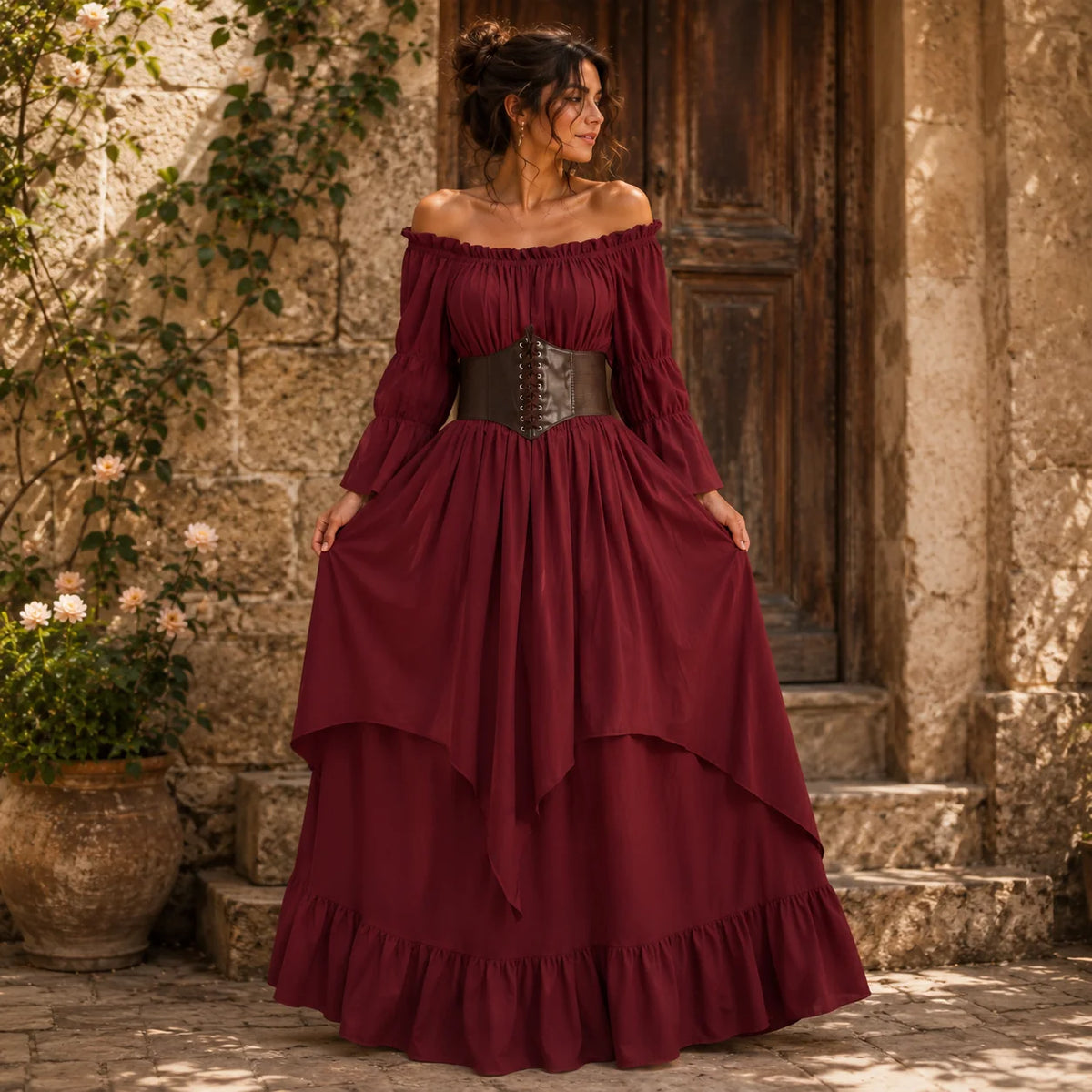 Woman wearing a flowing medieval dress with a brown lace-up waist cincher