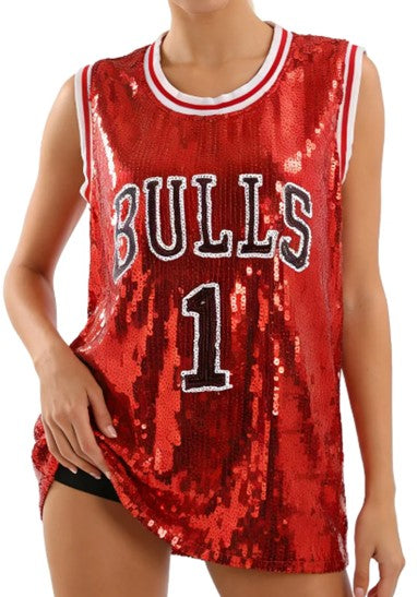 A woman wears the red sequin basketball jersey with striped trim, BULLS lettering and number 1.